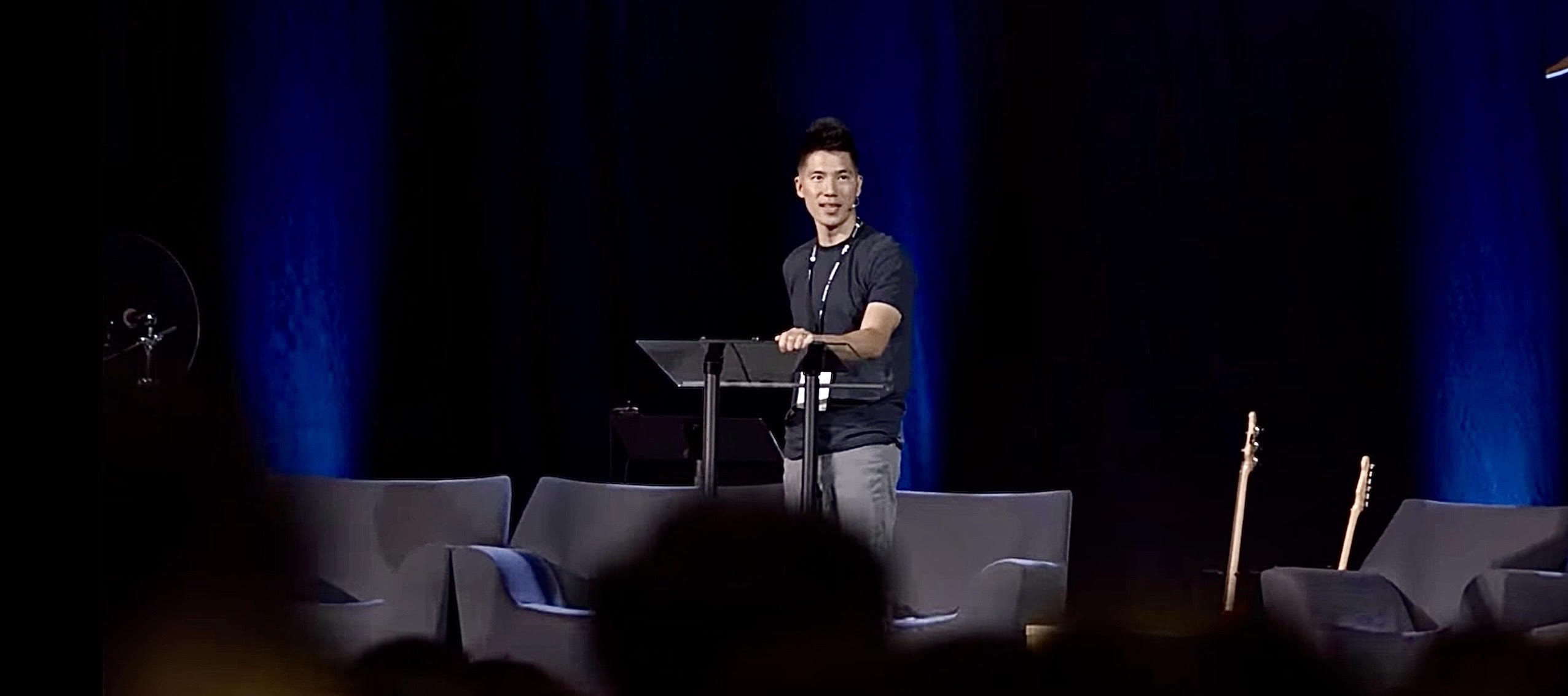 Dr. Jin Taek Chung speaking at a podium